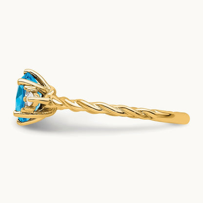 Polished Diamond and Blue Topaz Twisted Ring — 14K Yellow Gold