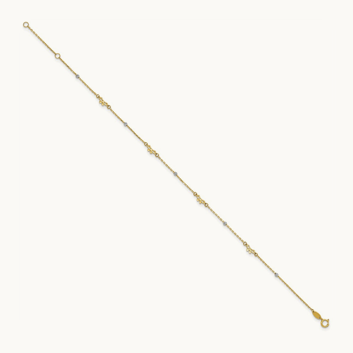 Polished 9in Plus 1in ext. D/C Bead and Bows Anklet, 14K Two-tone