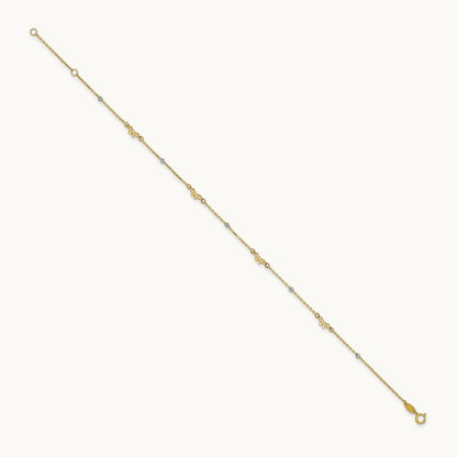Polished 9in Plus 1in ext. D/C Bead and Bows Anklet, 14K Two-tone