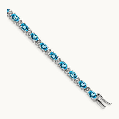 Oval Blue Topaz and Diamond Bracelet, 14K White Gold
