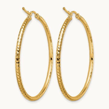 Diamond-cut Round Tube Hoop Earrings — 10K Yellow Gold
