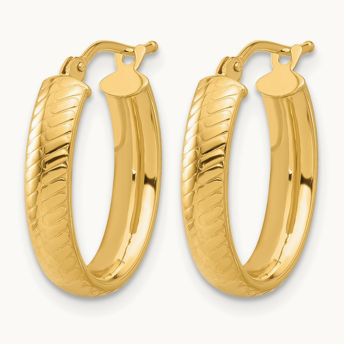 Polished and Textured Oval Hoop Earrings — Leslie's — photo set