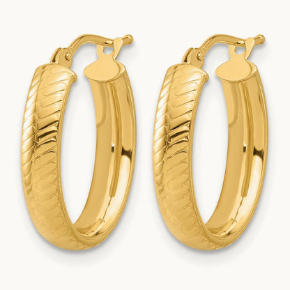 Polished and Textured Oval Hoop Earrings — Leslie's — photo set