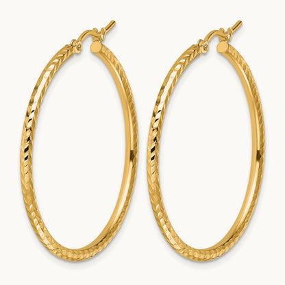 Diamond-cut Round Tube Hoop Earrings — 10K Yellow Gold