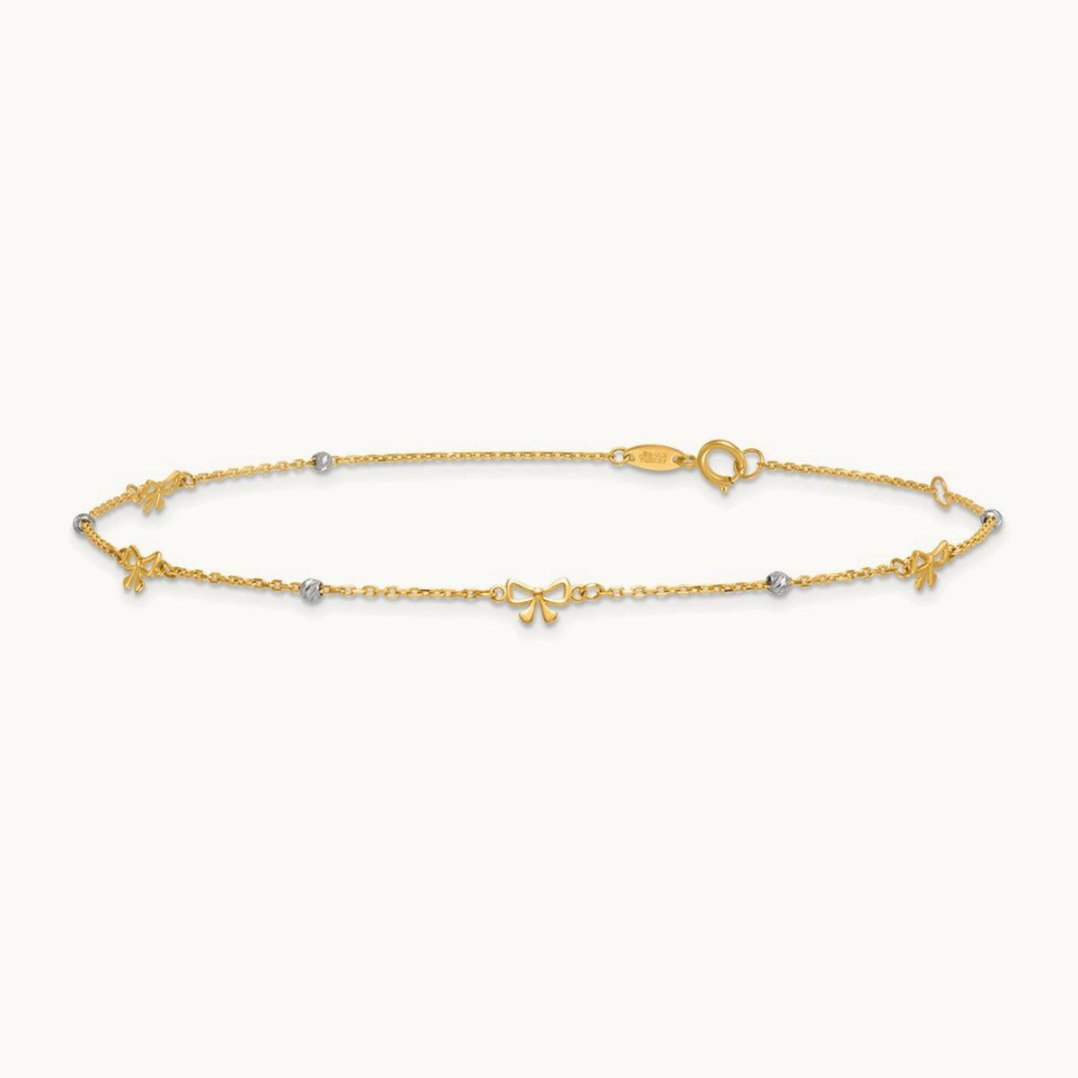 Polished 9in Plus 1in ext. D/C Bead and Bows Anklet, 14K Two-tone