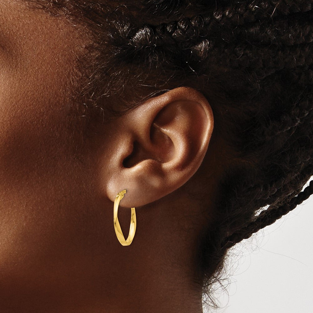 Polished Twisted Oval Hoop Earrings — photo set
