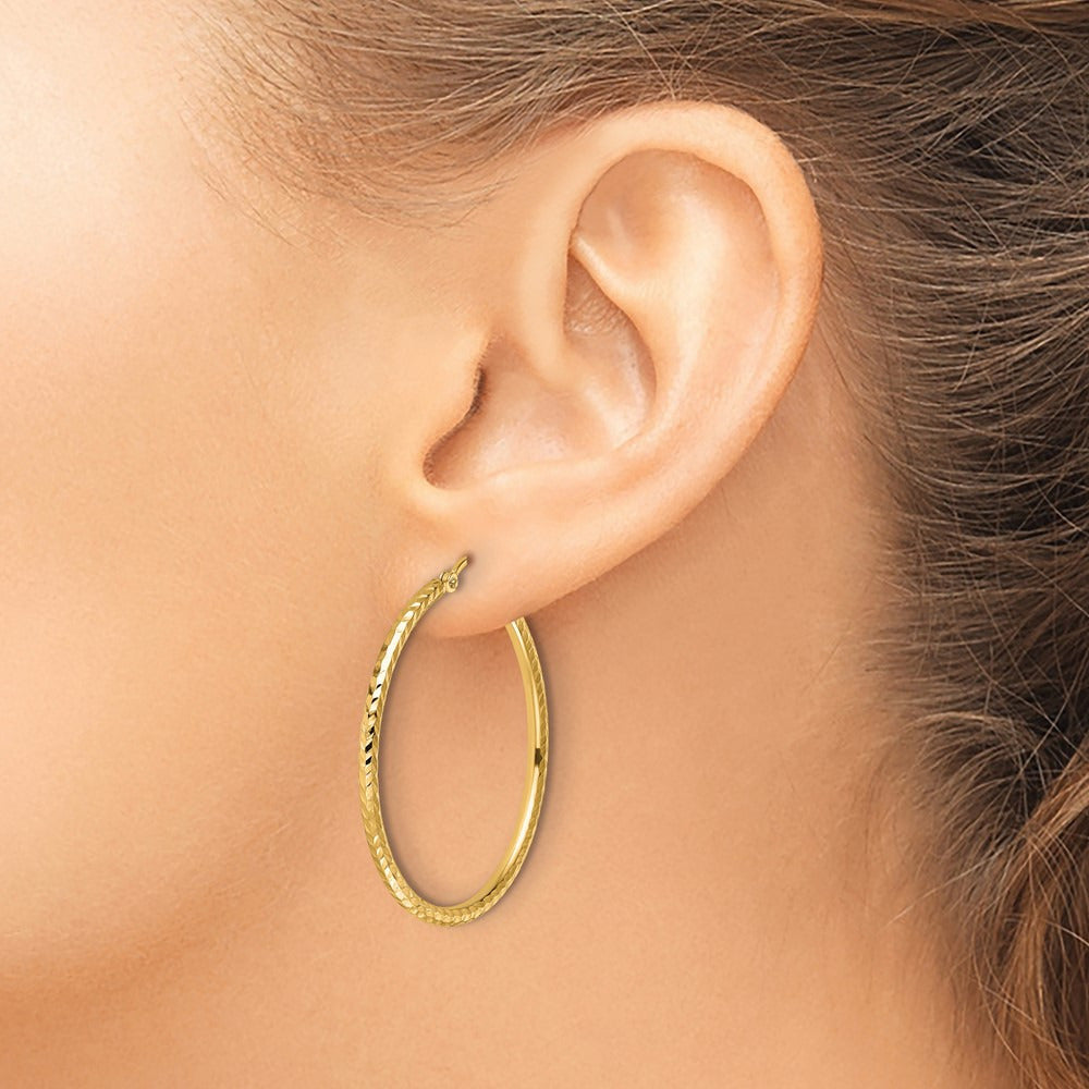 Diamond-cut Round Tube Hoop Earrings — 10K Yellow Gold