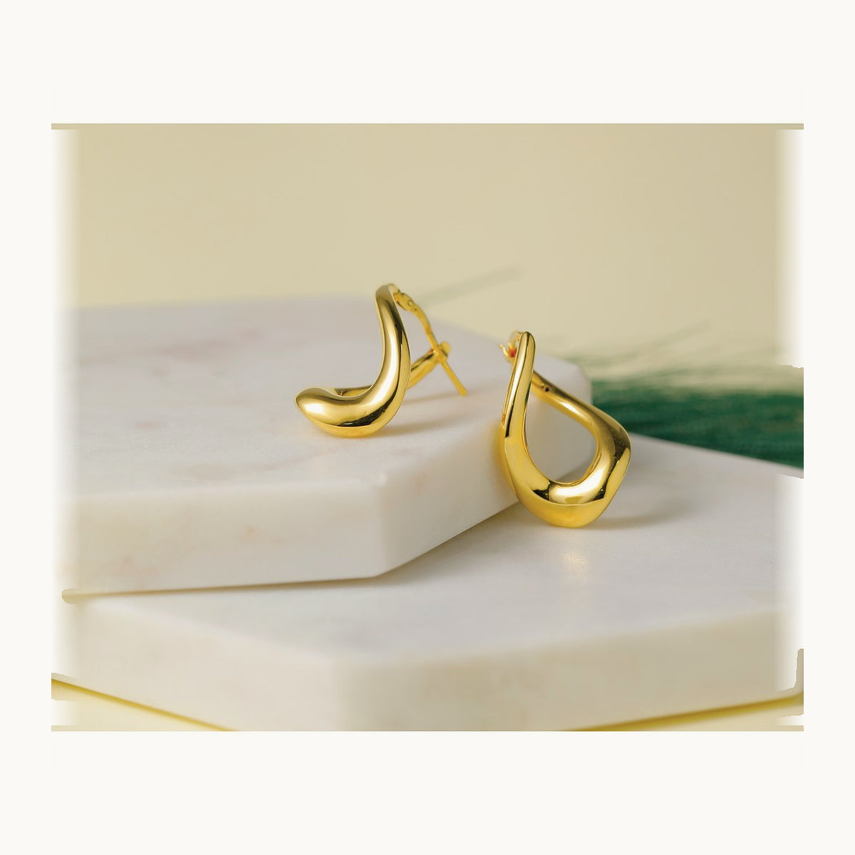Polished Twist Hoop Earrings — Leslie's — photo set