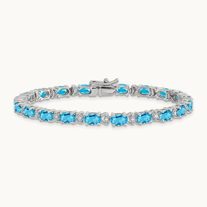 Oval Blue Topaz and Diamond Bracelet, 14K White Gold