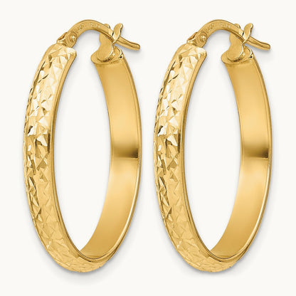 Polished Diamond-cut Oval Hoop Earrings — 14K Yellow Gold