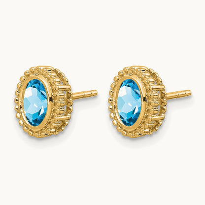 Oval Blue Topaz Post Earrings — 14K Yellow Gold