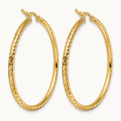 Diamond-cut Round Tube Hoop Earrings — 10K Yellow Gold
