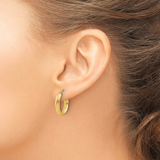 Polished and Textured Oval Hoop Earrings — Leslie's — photo set