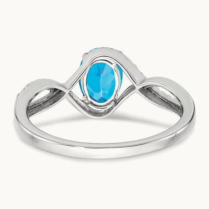 Oval Blue Topaz and Diamond Twist Ring, 14K White Gold