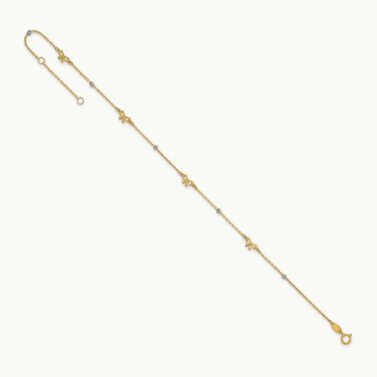 Polished 9in Plus 1in ext. D/C Bead and Bows Anklet, 14K Two-tone