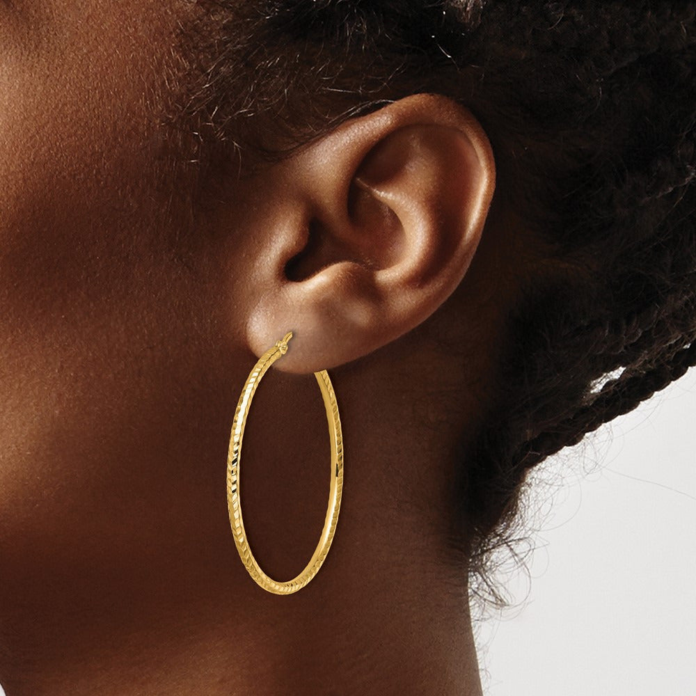Diamond-cut Round Tube Hoop Earrings — 10K Yellow Gold