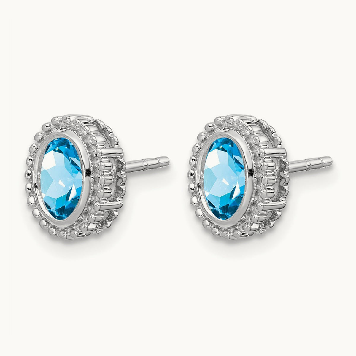 Oval Blue Topaz Post Earrings — 14K White Gold