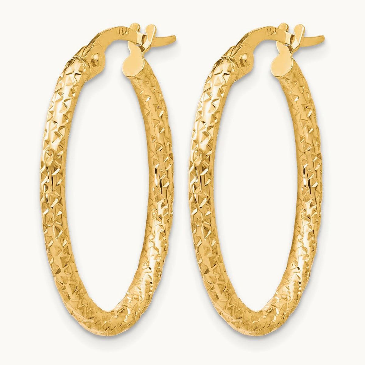 Polished Diamond-cut Oval Hoop Earrings — 10K Yellow Gold