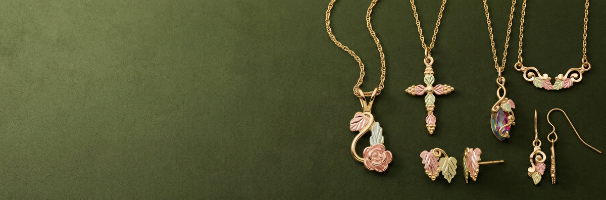 Landstrom's Black Hills Gold fall collection on olive green velvet
